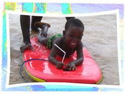 Boy riding Boogie Board